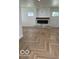 Bright living room features wood floors and a stylish fireplace at 2936 Guilford Ave, Indianapolis, IN 46205
