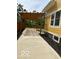 Concrete patio with a wooden pergola providing shade and a view of the yard and house at 2936 Guilford Ave, Indianapolis, IN 46205