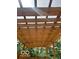 A wooden pergola offering a shaded view of the sunny backyard at 2936 Guilford Ave, Indianapolis, IN 46205