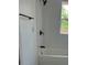 White tub with white tiled shower and black hardware at 2936 Guilford Ave, Indianapolis, IN 46205