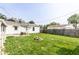 Backyard showcasing a lush green lawn, wooden fence, and comfortable outdoor space at 315 Schoolhouse Rd, Franklin, IN 46131