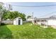 Large backyard featuring a storage shed and fire pit at 315 Schoolhouse Rd, Franklin, IN 46131