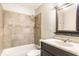 Bathroom with tiled shower over tub, vanity with undermount sink and vanity mirror at 315 Schoolhouse Rd, Franklin, IN 46131