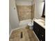 Tidy bathroom with a tiled shower and backsplash, vanity, and neutral wall color at 315 Schoolhouse Rd, Franklin, IN 46131