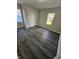 Cozy bedroom showcasing sleek vinyl floors, a double door closet, and bright, natural light at 315 Schoolhouse Rd, Franklin, IN 46131