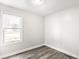 Light and airy bedroom with natural light, laminate flooring and neutral paint at 315 Schoolhouse Rd, Franklin, IN 46131