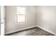 Cozy bedroom with laminate flooring, window and closet space at 315 Schoolhouse Rd, Franklin, IN 46131