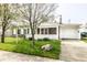 Inviting residence features a charming porch, stone accents, and a well-manicured lawn, set back from the street at 315 Schoolhouse Rd, Franklin, IN 46131