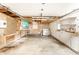 Garage featuring a concrete floor, open ceiling and walls, and shelving at 315 Schoolhouse Rd, Franklin, IN 46131