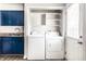 Convenient laundry area with washer, dryer, and built in shelving at 315 Schoolhouse Rd, Franklin, IN 46131