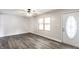 Comfortable living room featuring gray walls, modern flooring, and a bright window offering plenty of natural light at 315 Schoolhouse Rd, Franklin, IN 46131