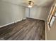 Spacious living room boasting stylish vinyl flooring, ceiling fan, and neutral wall colors at 315 Schoolhouse Rd, Franklin, IN 46131