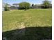 Lush backyard featuring a well-maintained lawn and mature trees at 3327 Brandenburg Blvd, Indianapolis, IN 46239