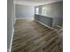 Bright bonus room features durable wood floors and natural light from the windows at 3327 Brandenburg Blvd, Indianapolis, IN 46239