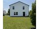 Exterior shot of the home, showcasing the back of the home and manicured lawn at 3327 Brandenburg Blvd, Indianapolis, IN 46239