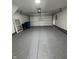 Spacious garage featuring painted floor, and a garage door with opener at 3327 Brandenburg Blvd, Indianapolis, IN 46239