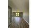 Open living area with wood floors, neutral walls, and natural light at 3327 Brandenburg Blvd, Indianapolis, IN 46239