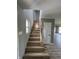Bright staircase with hardwood steps and floors and light-colored handrail at 3327 Brandenburg Blvd, Indianapolis, IN 46239