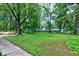 Enjoy outdoor living on this property with its spacious yard and new wooden deck surrounded by mature trees at 3339 Devereaux Dr, Indianapolis, IN 46228