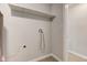 Spacious utility area with laundry hookups and storage shelving at 3339 Devereaux Dr, Indianapolis, IN 46228