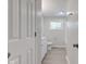 This bathroom showcases a modern vanity, window, and neutral paint at 3339 Devereaux Dr, Indianapolis, IN 46228