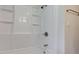 This bathroom features a new, bright white shower/tub combo at 3339 Devereaux Dr, Indianapolis, IN 46228