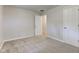 This bedroom features neutral paint, new carpet, and a large door for easy access at 3339 Devereaux Dr, Indianapolis, IN 46228