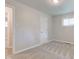 This bedroom has neutral paint, new carpet, and a large window for natural light at 3339 Devereaux Dr, Indianapolis, IN 46228