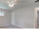 Cozy bedroom with a ceiling fan and large double door closet at 3339 Devereaux Dr, Indianapolis, IN 46228