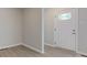 Inviting entryway featuring a stylish front door with decorative glass panel and neutral decor at 3339 Devereaux Dr, Indianapolis, IN 46228