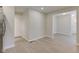 Bright entryway with a white front door and an open floor plan leading to other rooms at 3339 Devereaux Dr, Indianapolis, IN 46228
