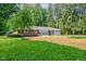 Charming brick ranch home featuring an attached garage and a lush front lawn at 3339 Devereaux Dr, Indianapolis, IN 46228