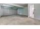 This garage boasts a large roll up door and access to the kitchen at 3339 Devereaux Dr, Indianapolis, IN 46228