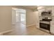 Updated kitchen with stainless steel appliances and a view of the living room and entryway at 3339 Devereaux Dr, Indianapolis, IN 46228