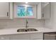 Kitchen sink with stainless steel faucet and view of backyard at 3339 Devereaux Dr, Indianapolis, IN 46228