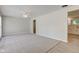 Bright living room featuring soft carpeting and neutral walls at 3339 Devereaux Dr, Indianapolis, IN 46228