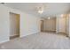 Bright living room featuring soft carpeting and neutral walls at 3339 Devereaux Dr, Indianapolis, IN 46228