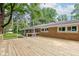 The expansive wooden deck extends across the rear of the home, perfect for entertaining and enjoying the outdoors at 3339 Devereaux Dr, Indianapolis, IN 46228