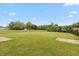 Green backyard with a large well maintained lawn at 3623 Carroll Farms Dr, Indianapolis, IN 46235