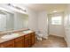 Bright bathroom featuring a double sink vanity, toilet, tile flooring and a separate shower at 3623 Carroll Farms Dr, Indianapolis, IN 46235