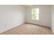 Bedroom featuring carpet flooring, white walls, one window, and an electrical outlet at 3623 Carroll Farms Dr, Indianapolis, IN 46235