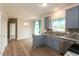 Bright kitchen with stainless steel appliances, granite countertops and breakfast nook with sliding door access at 3623 Carroll Farms Dr, Indianapolis, IN 46235