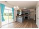 Bright kitchen with gray cabinets, stainless steel appliances, and a stylish chandelier at 3623 Carroll Farms Dr, Indianapolis, IN 46235