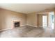 Spacious living room with a classic fireplace, neutral carpeting, and ample room at 3623 Carroll Farms Dr, Indianapolis, IN 46235