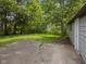 Large backyard with concrete area and trees at 3627 N Brentwood Ave, Indianapolis, IN 46235