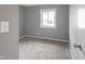 This bedroom features soft carpet, a window, and fresh paint at 3627 N Brentwood Ave, Indianapolis, IN 46235
