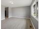 Living room featuring gray walls and light wood floors at 3627 N Brentwood Ave, Indianapolis, IN 46235