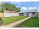 Wide backyard with walkway leading to shed at 3716 W 16Th St, Indianapolis, IN 46222
