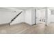 Finished basement with modern flooring, freshly painted with stairs and a toilet room at 3716 W 16Th St, Indianapolis, IN 46222
