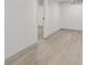 View of the basement featuring light gray wood laminate flooring at 3716 W 16Th St, Indianapolis, IN 46222